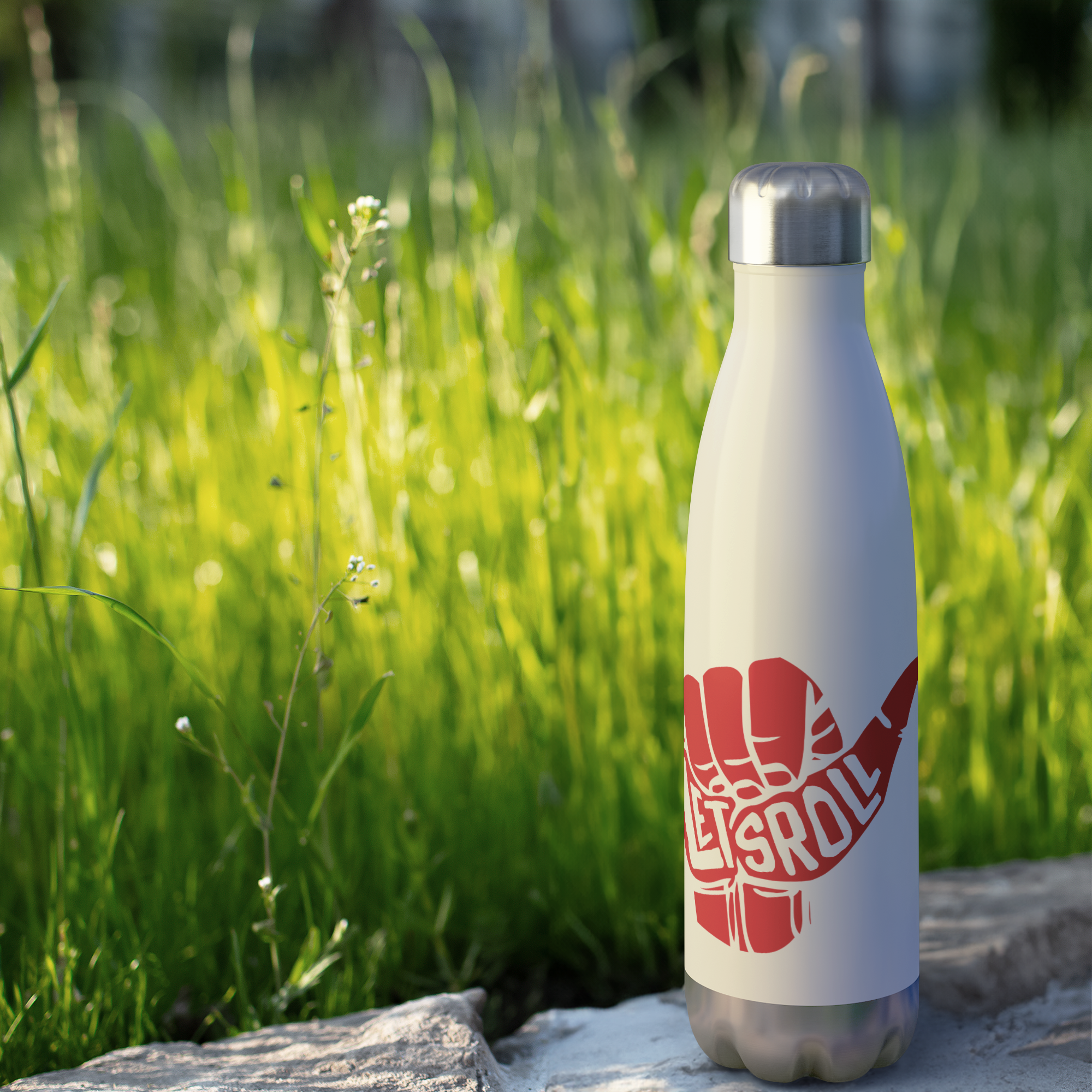 Lets_Roll_BJJ_Water_Bottle_20_oz_WaterBottle_Outdoor_grass_Mockup.png